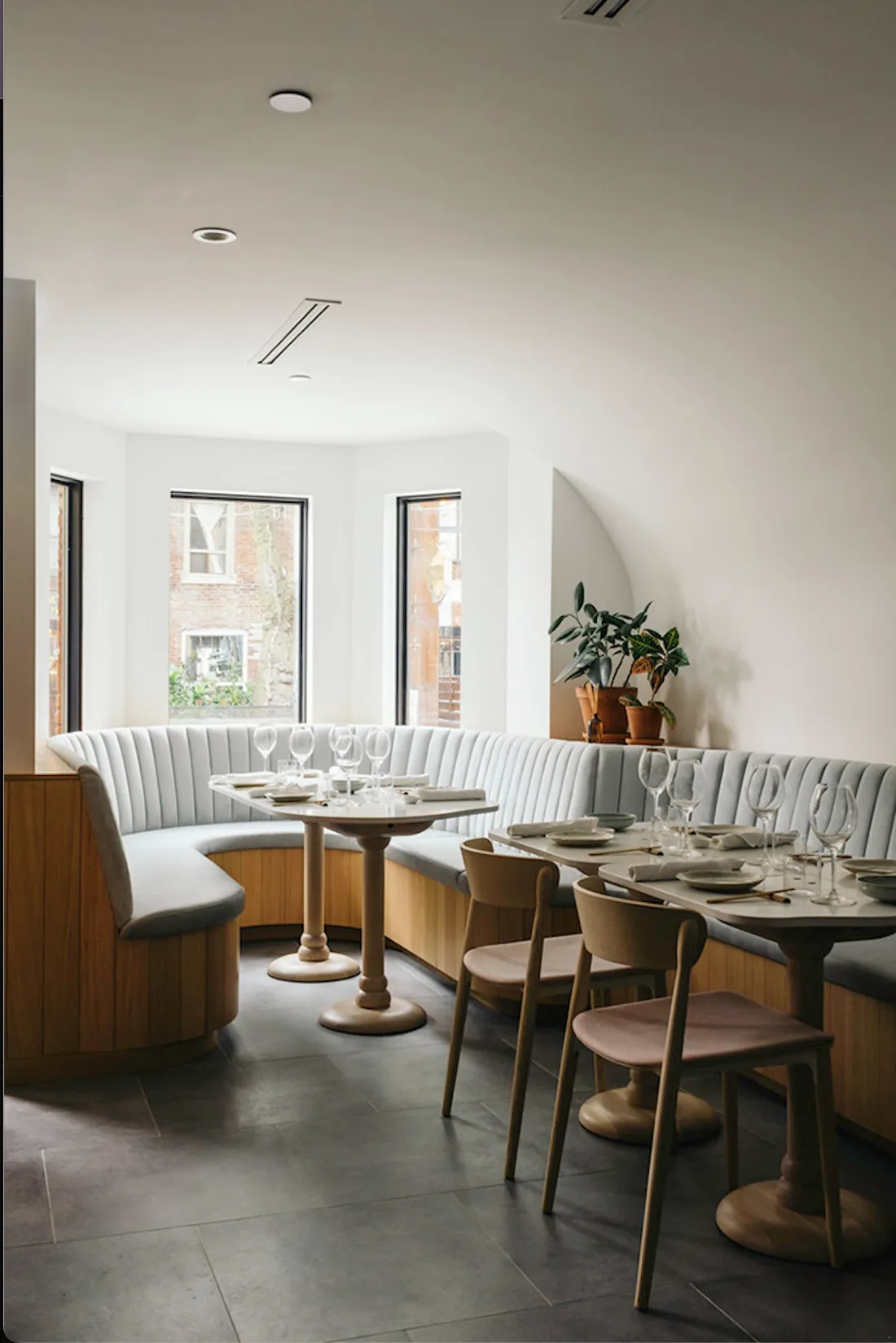 Sara restaurant curved banquette dining nook with bay windows
